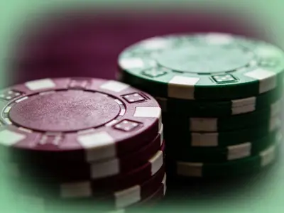 Stacked casino chips lit from the side