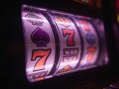 Slot reel symbols lit behind glass